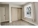 Empty bedroom with hardwood floors, natural light, and a closet at 4723 S Pagosa Way, Aurora, CO 80015