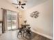 Cozy dining area with a ceiling fan, sliding glass doors to the backyard, and unique bird artwork at 4723 S Pagosa Way, Aurora, CO 80015