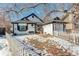 House exterior showcasing snowy front yard and white picket fence at 4723 S Pagosa Way, Aurora, CO 80015