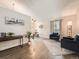 Inviting living room showcasing hardwood floors, vaulted ceilings, and elegant decor with natural lighting at 4723 S Pagosa Way, Aurora, CO 80015