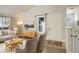 Bright living room featuring mid-century furniture and hardwood floors at 4723 S Pagosa Way, Aurora, CO 80015