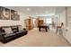 Spacious finished basement with a pool table, leather sofa, and barn doors offering entertainment and relaxation at 6630 S Coolidge Ct, Aurora, CO 80016