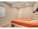 Cozy bedroom with neutral walls, carpet and stylish lighting fixtures at 6630 S Coolidge Ct, Aurora, CO 80016