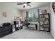Comfortable bedroom with carpet, a window for natural light, and ample storage space at 6630 S Coolidge Ct, Aurora, CO 80016