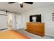 Spacious main bedroom with a TV, dresser, and an en-suite bathroom at 6630 S Coolidge Ct, Aurora, CO 80016