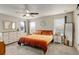 Bright main bedroom with a ceiling fan, bedside tables, and calming decor at 6630 S Coolidge Ct, Aurora, CO 80016