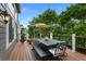 Inviting back deck with a dining table, grill, and seating for outdoor entertaining at 7027 Chestnut Hill St, Highlands Ranch, CO 80130