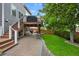 Inviting backyard patio with lush lawn, beautiful landscaping, and an elevated deck that's perfect for outdoor entertaining at 7027 Chestnut Hill St, Highlands Ranch, CO 80130