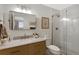 Modern bathroom featuring a sleek vanity, stylish mirror, and glass-enclosed shower at 7027 Chestnut Hill St, Highlands Ranch, CO 80130