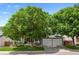 Traditional home with an attached three-car garage and mature trees shading the manicured lawn at 7027 Chestnut Hill St, Highlands Ranch, CO 80130