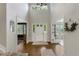 Bright foyer featuring soaring ceilings and hardwood floors, welcoming you into this elegant home at 7027 Chestnut Hill St, Highlands Ranch, CO 80130