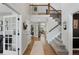 Bright entryway with hardwood floors and staircase at 7027 Chestnut Hill St, Highlands Ranch, CO 80130