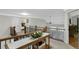 An open second floor hallway with carpet, and views into other rooms at 7027 Chestnut Hill St, Highlands Ranch, CO 80130