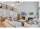 Spacious living room with fireplace, hardwood floors, loft, and comfortable seating at 7027 Chestnut Hill St, Highlands Ranch, CO 80130