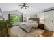 Beautiful bedroom with neutral paint, a ceiling fan, and a large window with a green view at 7027 Chestnut Hill St, Highlands Ranch, CO 80130