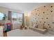 A bright playroom has climbing wall, hardwood floors, and neutral paint at 7027 Chestnut Hill St, Highlands Ranch, CO 80130