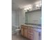 Bright bathroom with double vanity, granite countertop, and a glass-enclosed shower at 8311 Parkland St, Broomfield, CO 80021