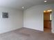 Neutral bedroom with doorway leading to an attached bathroom at 8311 Parkland St, Broomfield, CO 80021