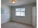 Bright bedroom with neutral carpet, window, and white trim, offering a serene retreat at 8311 Parkland St, Broomfield, CO 80021