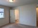 Light-filled bedroom with neutral carpet featuring an ensuite bathroom for added convenience at 8311 Parkland St, Broomfield, CO 80021