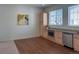 Kitchen area features light wood cabinets and stainless steel appliances at 8311 Parkland St, Broomfield, CO 80021