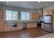 Kitchen with stainless steel appliances, granite counters, light wood cabinets, and recessed lighting at 8311 Parkland St, Broomfield, CO 80021