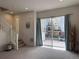 Bright living room with staircase and sliding glass door at 8311 Parkland St, Broomfield, CO 80021