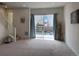 Living room with stairway and sliding glass door at 8311 Parkland St, Broomfield, CO 80021