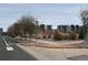 Street view of modern apartments with sidewalks and landscaped median in a residential neighborhood at 8311 Parkland St, Broomfield, CO 80021