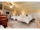 Cozy bedroom features two beds, wood plank ceiling with fan, and natural light at 28251 Shadow Mountain Dr, Conifer, CO 80433