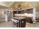 Kitchen featuring a wood ceiling, stainless appliances, granite countertops, and island with seating at 28251 Shadow Mountain Dr, Conifer, CO 80433