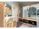 Inviting mud room features blue shiplap walls, marble countertop, and convenient shoe storage at 28251 Shadow Mountain Dr, Conifer, CO 80433