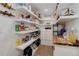 Well-stocked pantry with ample shelving, cabinets, and organization at 28251 Shadow Mountain Dr, Conifer, CO 80433
