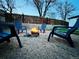 Inviting backyard with a fire pit and Adirondack chairs at 9411 Rose Ct, Thornton, CO 80229