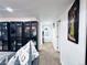 Bright hallway with white walls leading to a bathroom, complemented by stylish decor at 9411 Rose Ct, Thornton, CO 80229