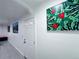 Hallway with a door and colorful decorative wall art at 9411 Rose Ct, Thornton, CO 80229