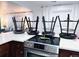 A modern kitchen featuring a white countertop and state-of-the-art stainless steel oven range at 9411 Rose Ct, Thornton, CO 80229