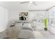 Bright, airy bedroom with neutral tones, a large window, and stylish decor at 1550 S Syracuse St, Denver, CO 80231