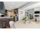 Open concept dining area with hardwood floors next to the living room and kitchen at 1550 S Syracuse St, Denver, CO 80231
