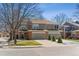 Charming two-story home with an attached garage and well-maintained landscaping at 1550 S Syracuse St, Denver, CO 80231