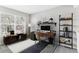 Bright home office with a large window, stylish desk setup, and modern decor at 1550 S Syracuse St, Denver, CO 80231