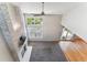 Bright living room with fireplace, large windows and sliding door at 1550 S Syracuse St, Denver, CO 80231