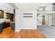 Open concept living space with hardwood floors adjacent to the kitchen at 1550 S Syracuse St, Denver, CO 80231