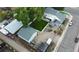 Spacious home featuring a large backyard, detached garage, and additional outdoor structures at 195 Briggs St, Erie, CO 80516