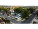 Aerial view of neighborhood with beautiful mature trees and a view of the Front Range at 195 Briggs St, Erie, CO 80516