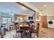 Cozy kitchen featuring oak cabinets, black appliances, and tile floors at 195 Briggs St, Erie, CO 80516