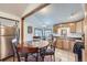 Eat-in kitchen featuring oak cabinetry, tile floor, and stainless steel appliances at 195 Briggs St, Erie, CO 80516