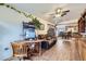 Living room with a desk and office space open to the kitchen and dining area and a cozy reclining sofa at 195 Briggs St, Erie, CO 80516