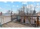 Wooden deck with railings providing an outdoor space with a view of the neighborhood at 471 S Grant St, Denver, CO 80209