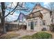 Backyard area with a patio, small patch of grass, and second-story deck on house at 471 S Grant St, Denver, CO 80209